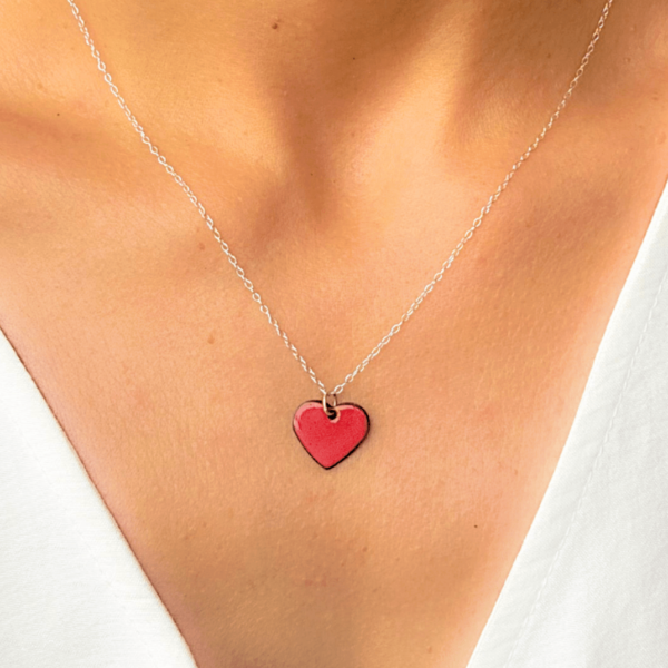 red enamel heart pendant on silver necklace