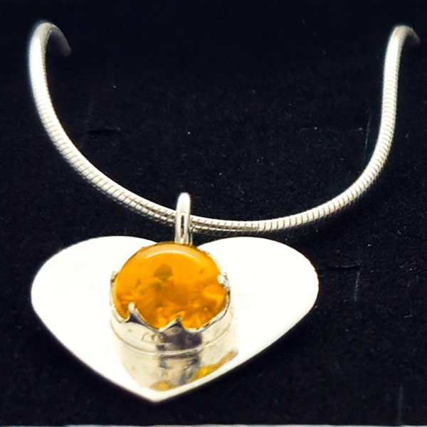 close upHandmade ashes in glass necklace in sterling silver – memorial jewellery UK