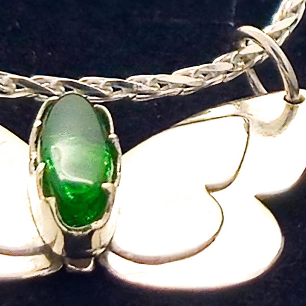 close up handmade ashes in glass butterfly necklace in sterling silver – memorial jewellery UK