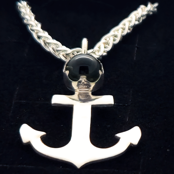 close up handmade ashes in glass anchor necklace in sterling silver – memorial jewellery UK