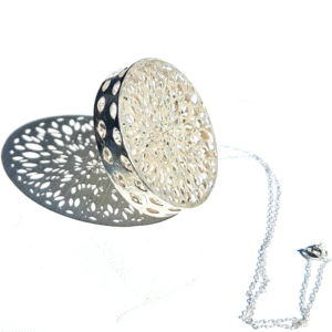 pierced silver brooch pendants